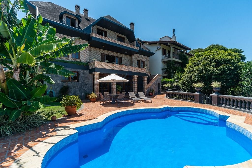 Casa em Condomínio à venda com 550m², 4 dormitórios, 3 suítes, 3 vagas no bairro Cavalhada em Porto Alegre - Foto 1