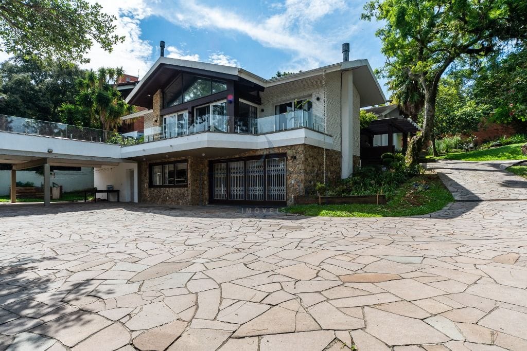 Casa à venda com 600m², 3 dormitórios, 3 suítes, 6 vagas no bairro Vila Assunção em Porto Alegre - Foto 1