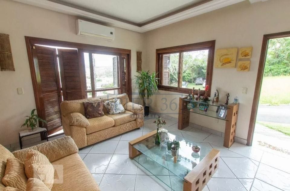 Casa em Condomínio à venda com 304m², 4 dormitórios, 1 suíte, 3 vagas no bairro Cavalhada em Porto Alegre - Foto 1