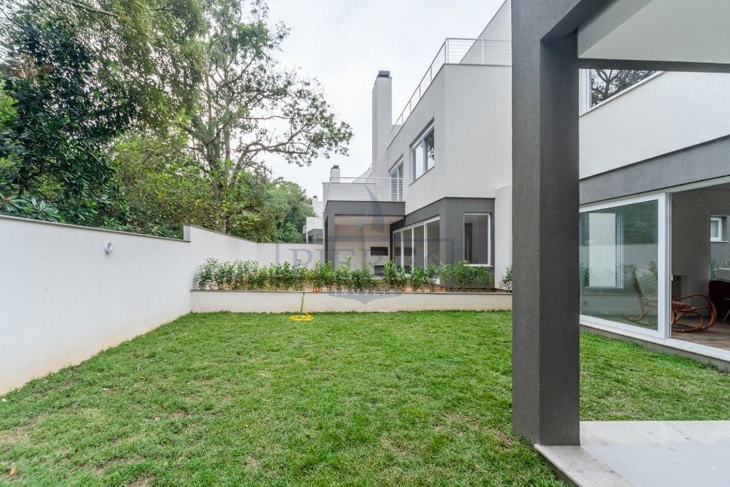 Casa em Condomínio à venda com 438m², 3 dormitórios, 3 suítes, 3 vagas no bairro Pedra Redonda em Porto Alegre - Foto 1